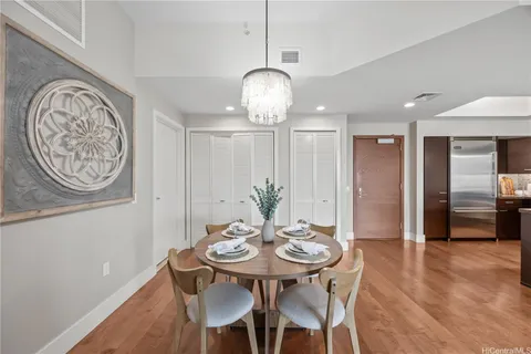 a view of a dining room with furniture and wooden floor