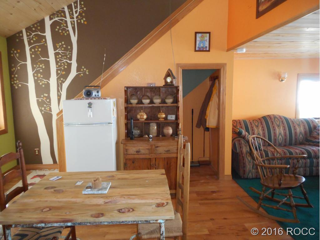 44 Riata Run Road Hartsel, CO 80449 - Photo 13 of 18 a living room with furniture and a fireplace