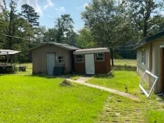 a view of backyard with a garden and entertaining space