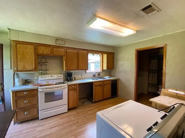a kitchen with a stove and a sink