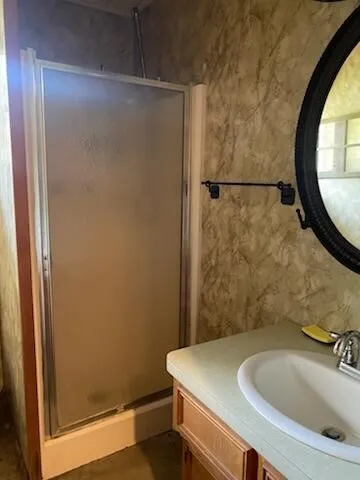 a bathroom with a sink and a mirror
