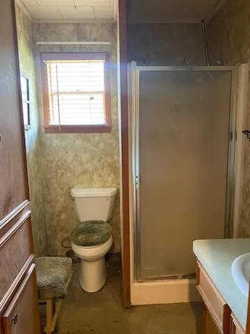 a bathroom with a toilet and a sink