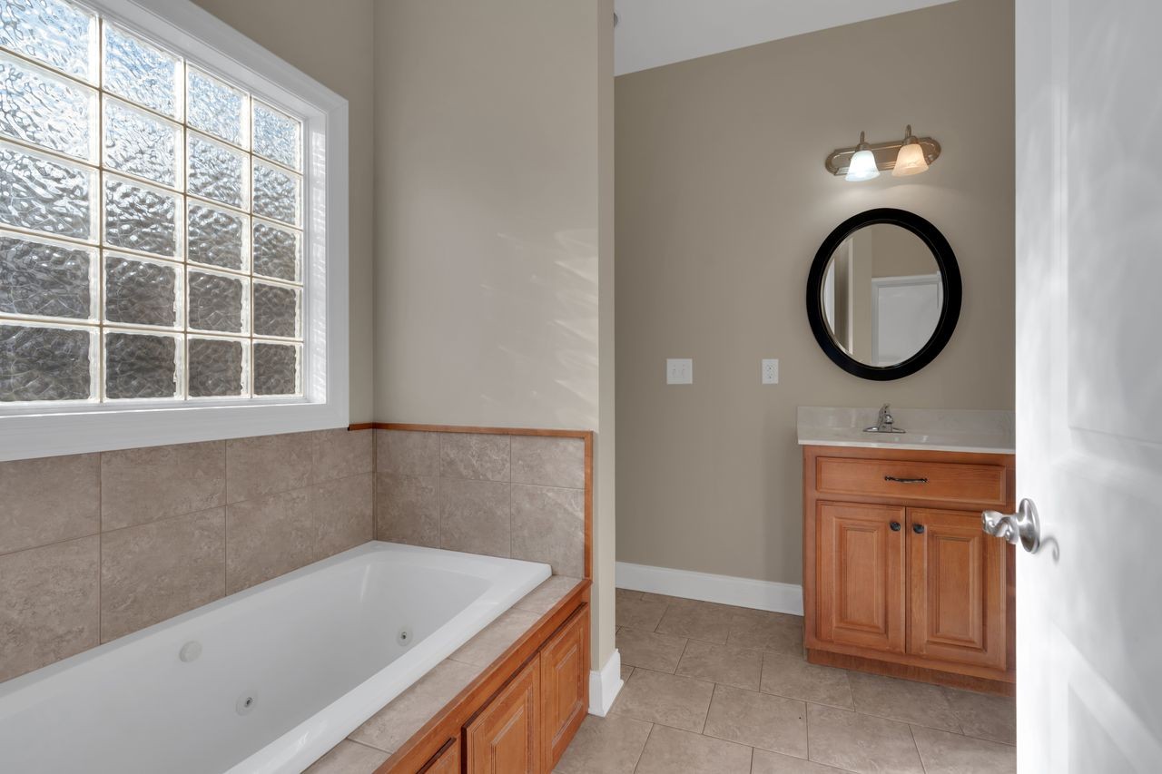 111 Reed's Lane Sewanee, TN 37375 - Photo 22 of 36 a bathroom with a sink and a bathtub