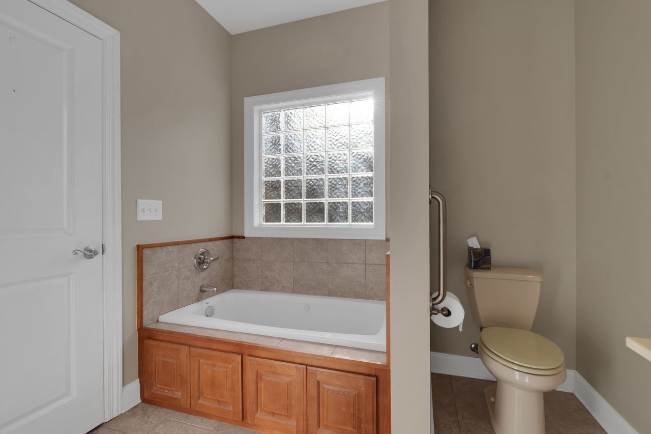 111 Reed's Lane Sewanee, TN 37375 - Photo 23 of 36 a bathroom with a sink and toilet