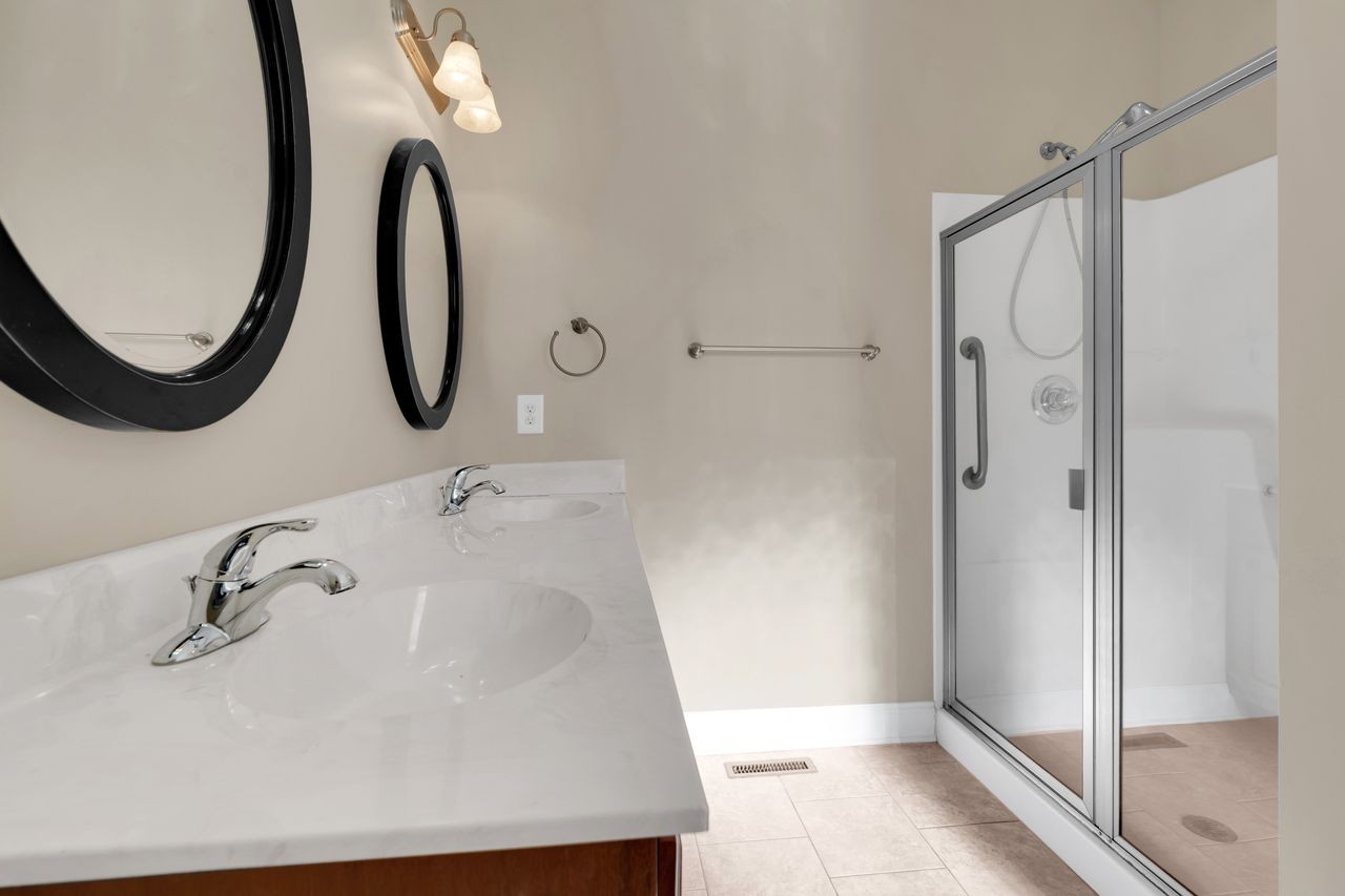 111 Reed's Lane Sewanee, TN 37375 - Photo 24 of 36 a bathroom with a sink and a mirror