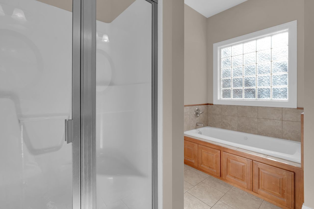 111 Reed's Lane Sewanee, TN 37375 - Photo 25 of 36 a bathroom with a bathtub and a sink