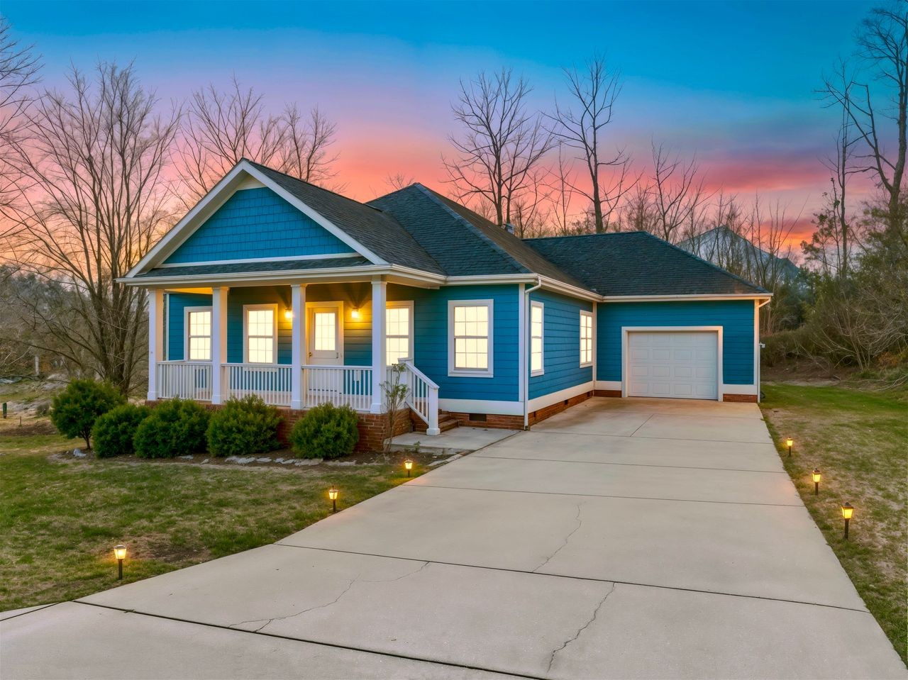111 Reed's Lane Sewanee, TN 37375 - Photo 3 of 36 a front view of a house with garden