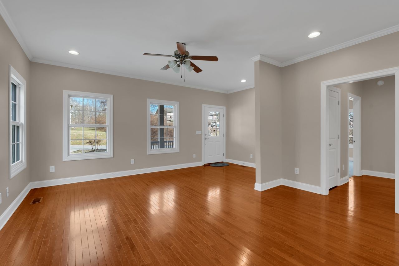 111 Reed's Lane Sewanee, TN 37375 - Photo 5 of 36 a view of an empty room with wooden floor and a window