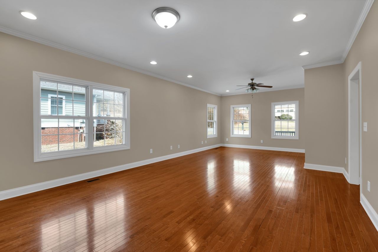 111 Reed's Lane Sewanee, TN 37375 - Photo 6 of 36 a view of an empty room with wooden floor and a window