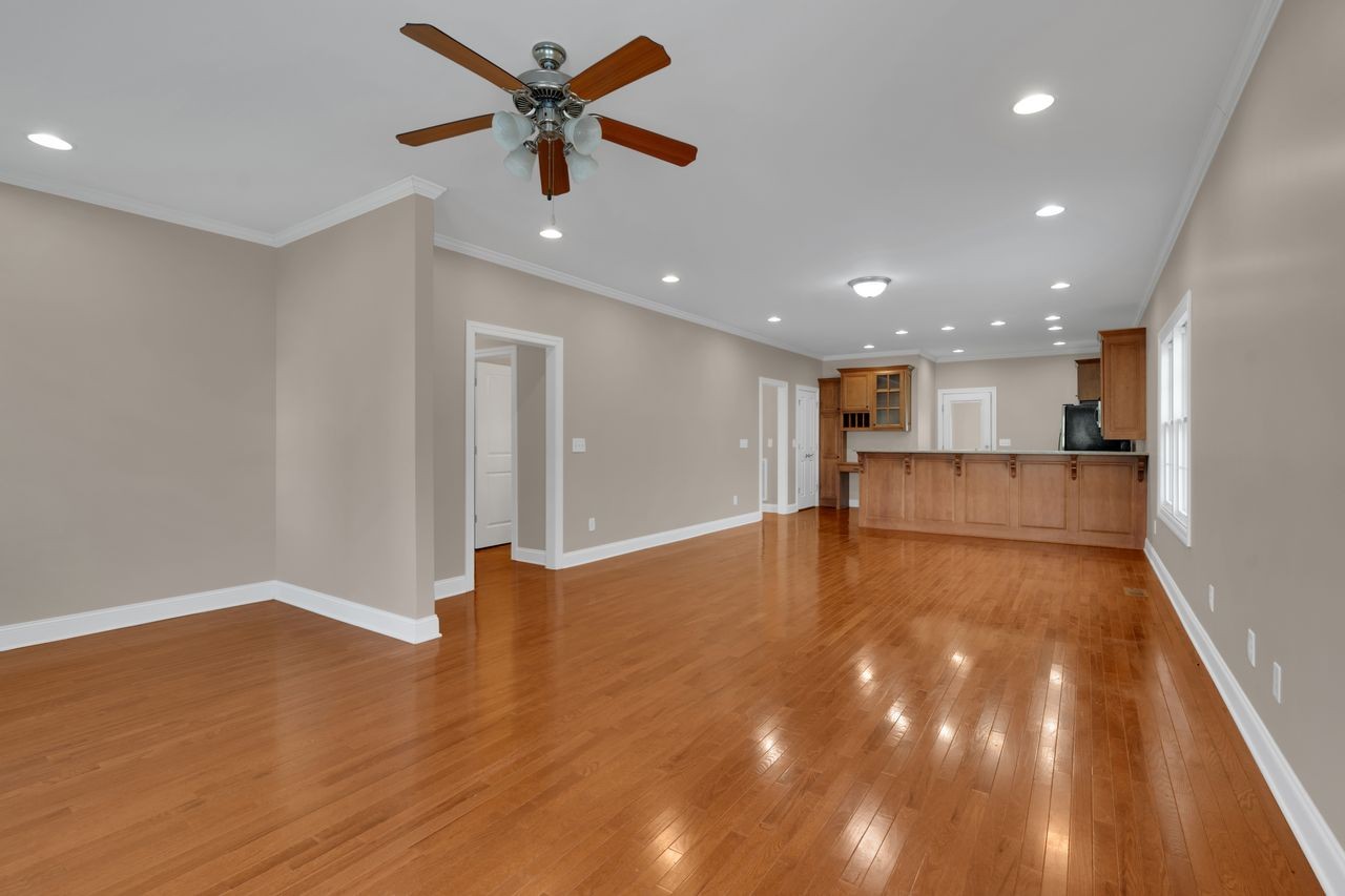 111 Reed's Lane Sewanee, TN 37375 - Photo 7 of 36 a view of empty room with wooden floor and fan