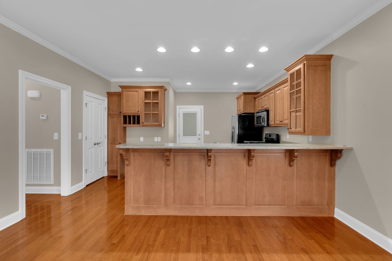 111 Reed's Lane Sewanee, TN 37375 - Photo 9 of 36 a view of kitchen with stainless steel appliances granite countertop cabinets and wooden floor