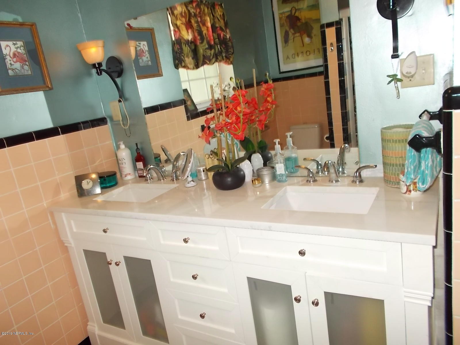 1501 River Bluff Road North Jacksonville, FL 32211 - Photo 12 of 33 a bathroom with a sink and a mirror