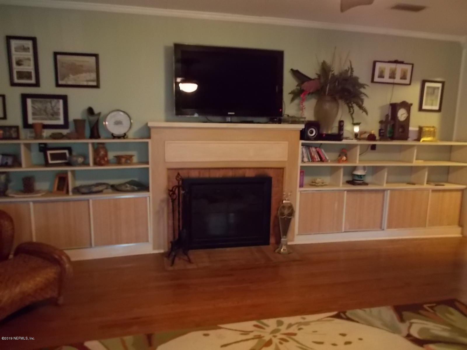 1501 River Bluff Road North Jacksonville, FL 32211 - Photo 16 of 33 a living room with furniture and a fireplace