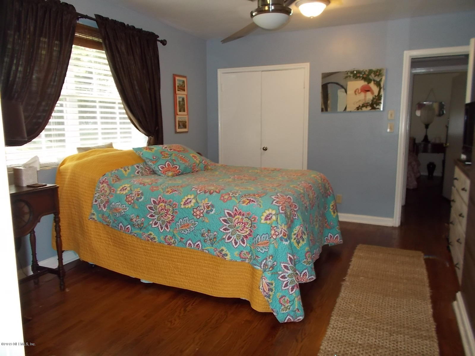 1501 River Bluff Road North Jacksonville, FL 32211 - Photo 17 of 33 a bedroom with a bed and wooden floor