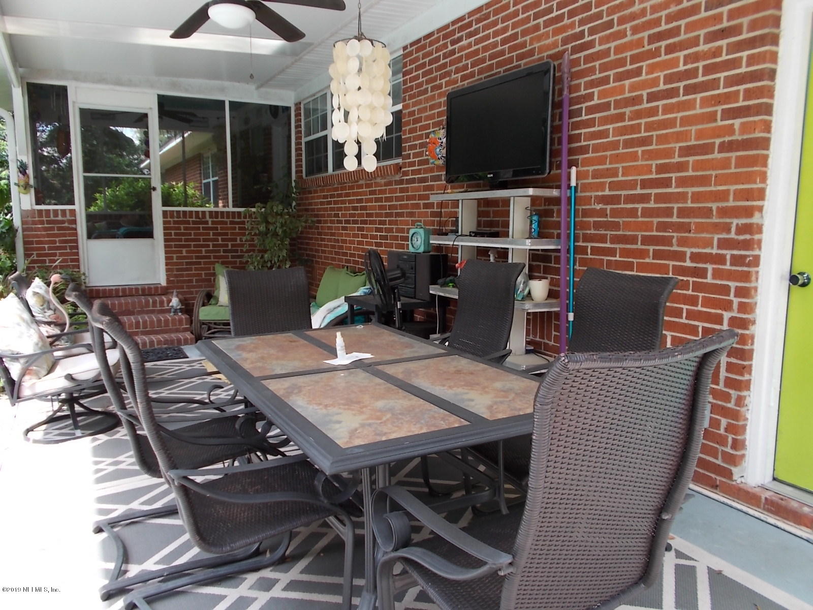 1501 River Bluff Road North Jacksonville, FL 32211 - Photo 25 of 33 a backyard of a house with table and chairs
