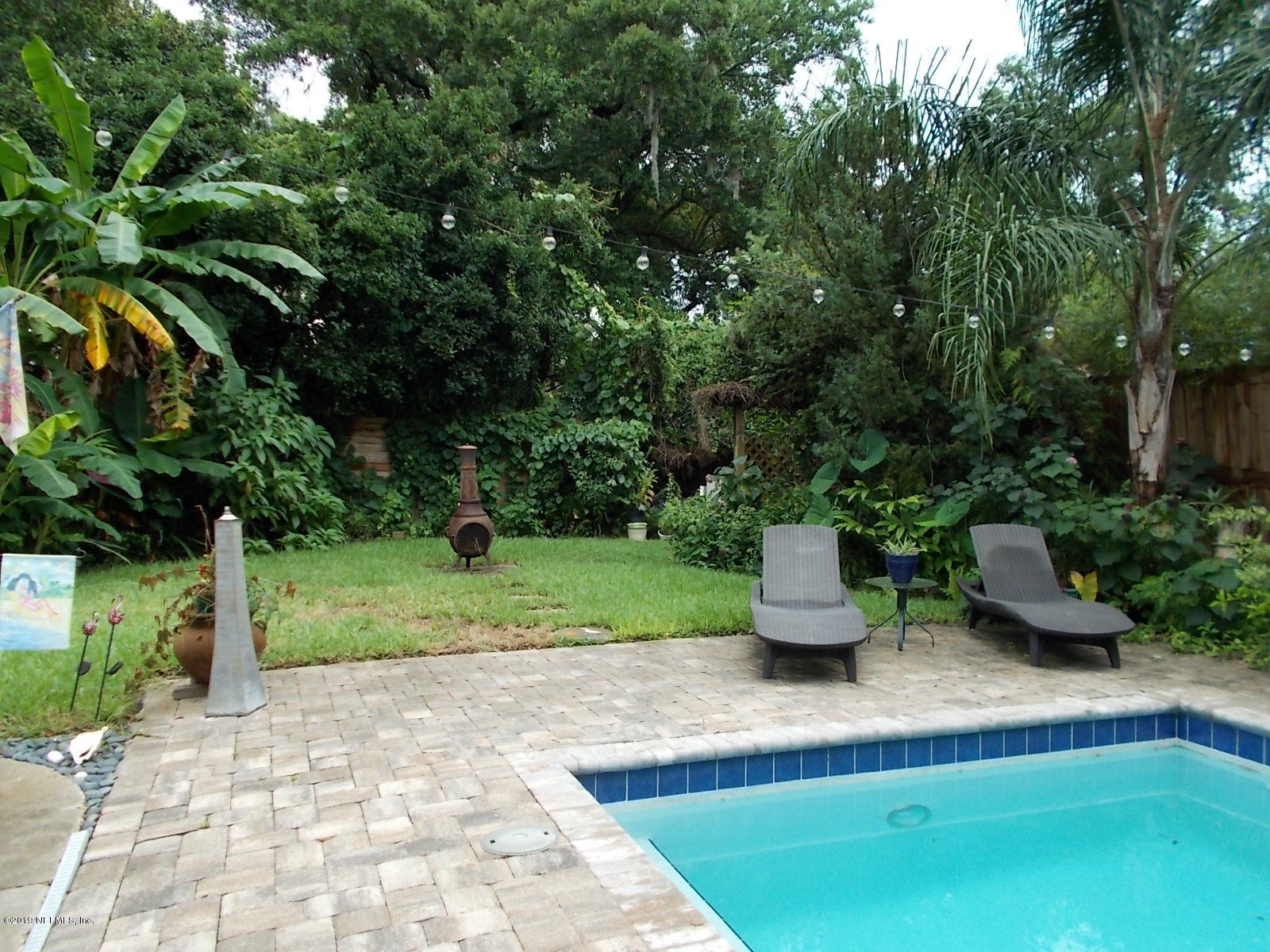 1501 River Bluff Road North Jacksonville, FL 32211 - Photo 27 of 33 a view of a garden with lawn chairs