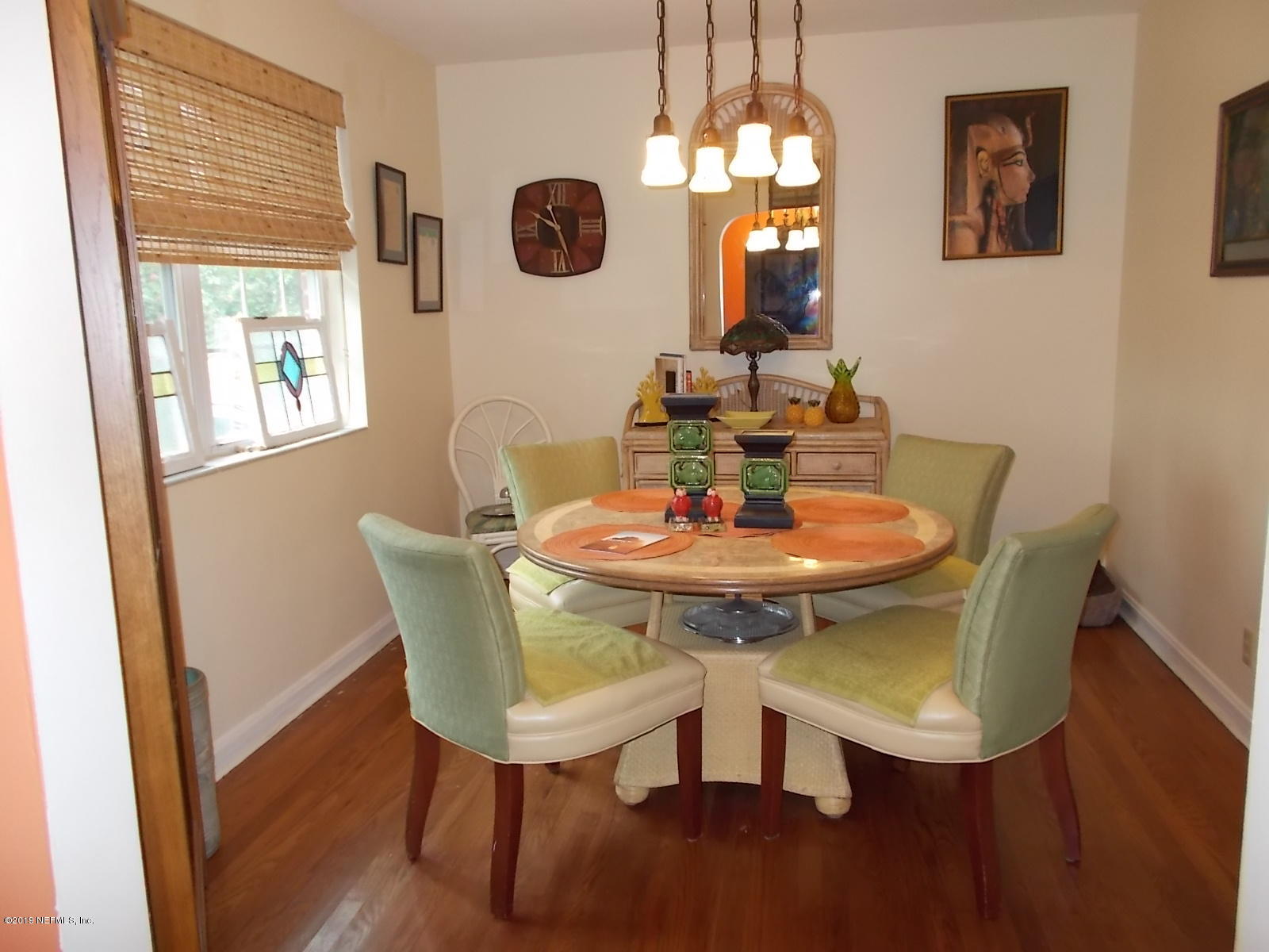 1501 River Bluff Road North Jacksonville, FL 32211 - Photo 3 of 33 a view of a dining room with furniture and wooden floor