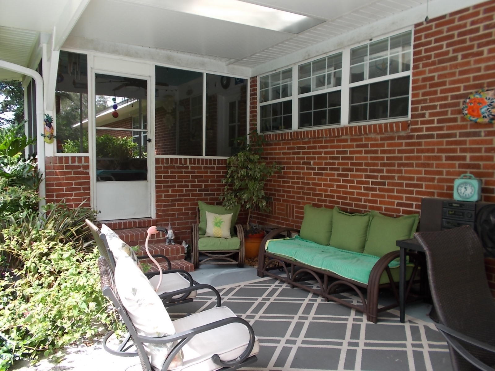 1501 River Bluff Road North Jacksonville, FL 32211 - Photo 33 of 33 a view of a patio with couple of chairs and a potted plant