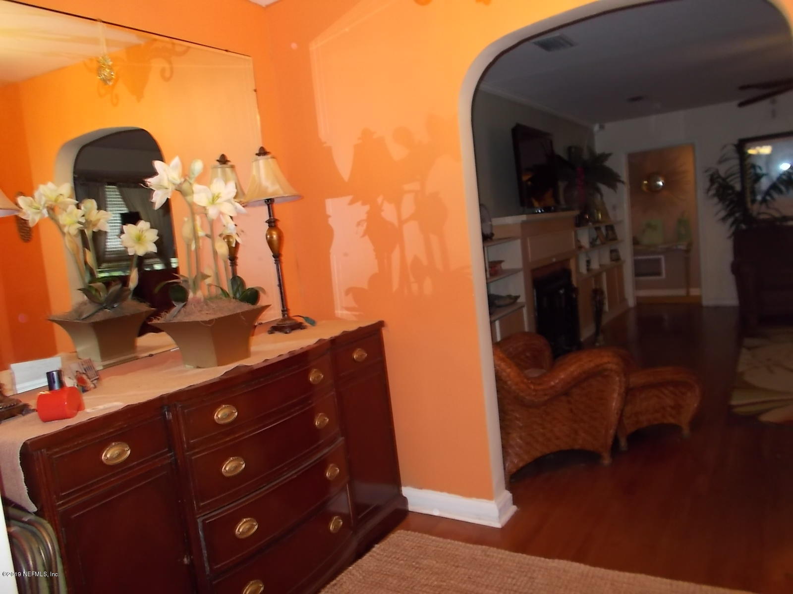 1501 River Bluff Road North Jacksonville, FL 32211 - Photo 5 of 33 a living room with furniture and a dresser