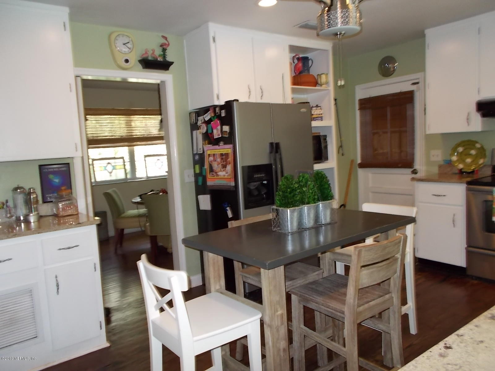 1501 River Bluff Road North Jacksonville, FL 32211 - Photo 8 of 33 a view of a dining room with furniture and wooden floor