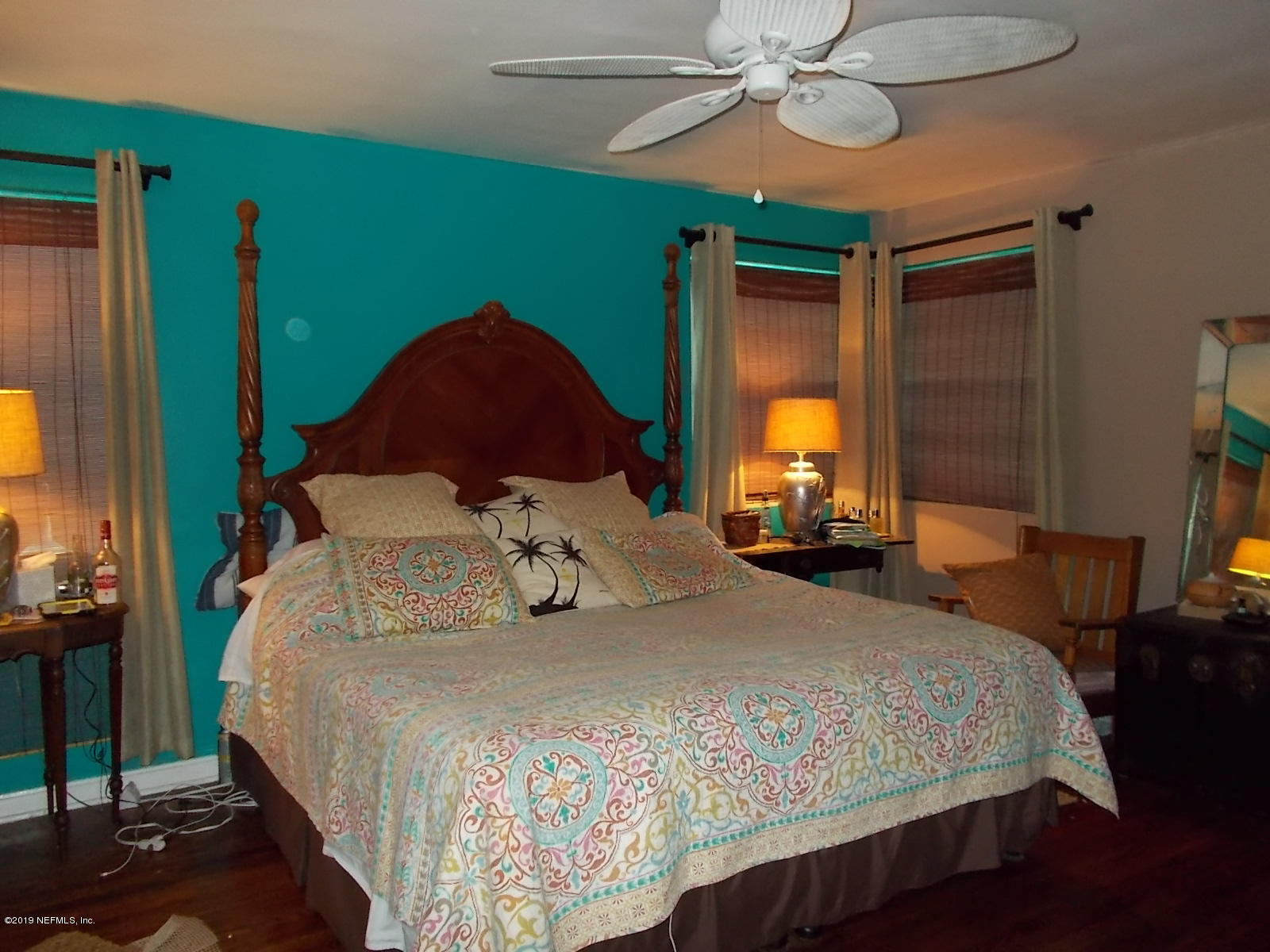 1501 River Bluff Road North Jacksonville, FL 32211 - Photo 9 of 33 a bedroom with a bed and a chandelier