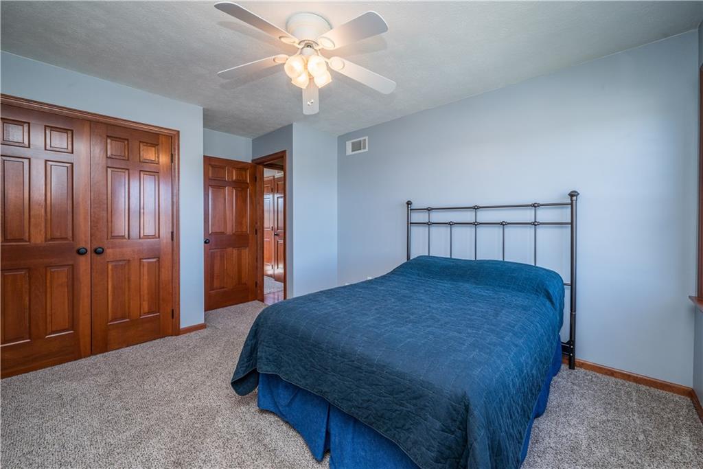 108 Pebble Court McKees Rocks, PA 15136 - Photo 28 of 39 a bedroom with a bed and a chandelier