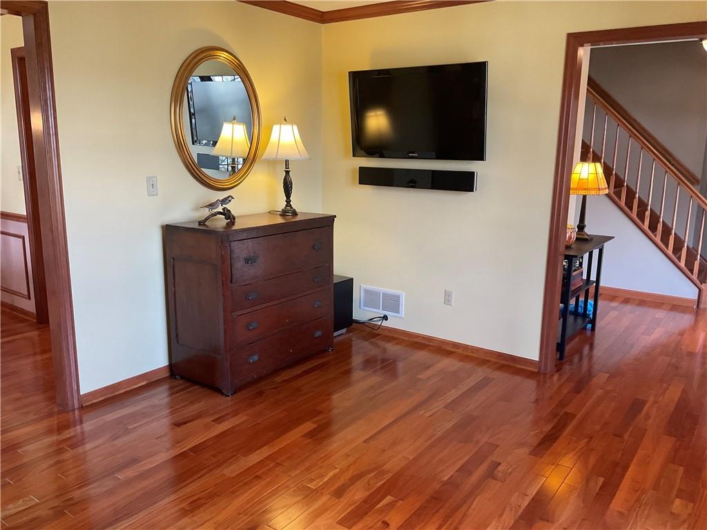 108 Pebble Court McKees Rocks, PA 15136 - Photo 6 of 39 a living room with chair and a flat screen tv