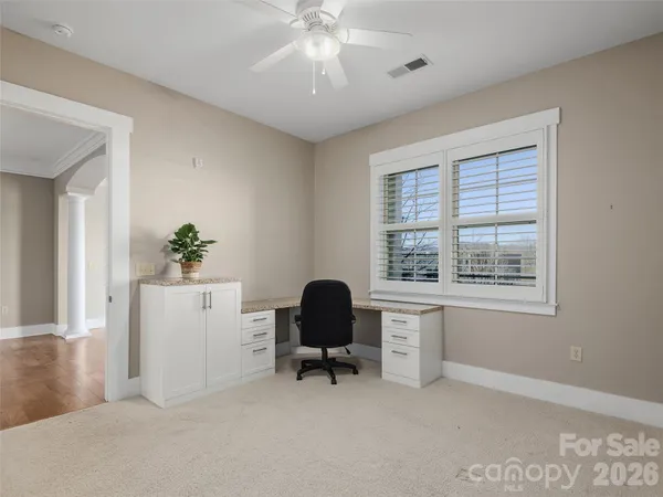 a workspace with furniture and a window