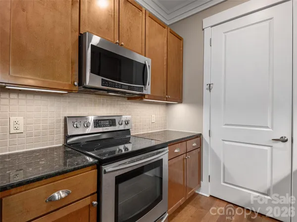 a kitchen with a stove and a microwave