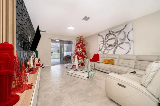 a living room with lots of furniture and a flat screen tv