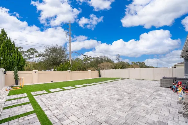 a kitchen with sink cabinets and stove