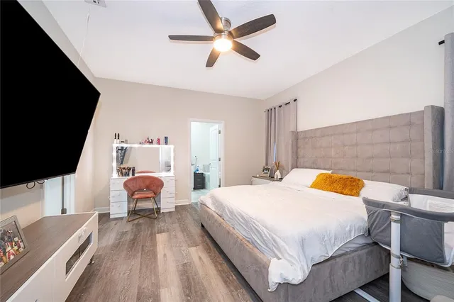 a bathroom with a tub double sink and mirror