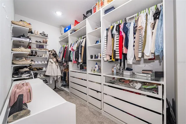 a bathroom with a toilet a sink and a large mirror