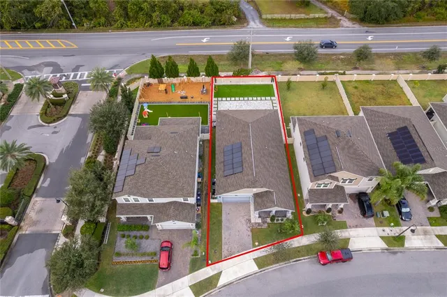 an aerial view of a house with a garden