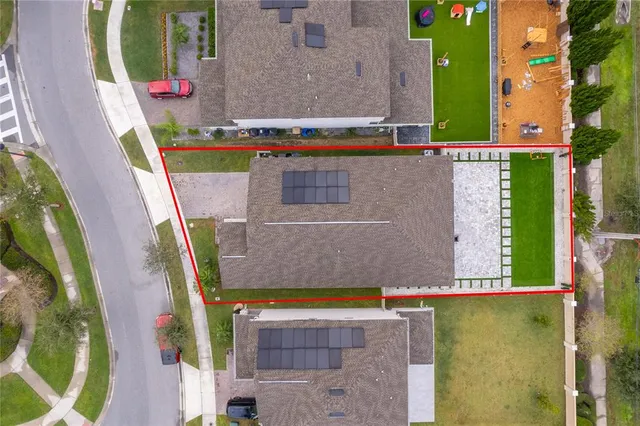 an aerial view of a house with a garden and plants