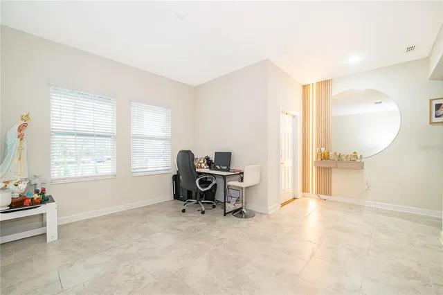 a kitchen with kitchen island granite countertop a sink stove and refrigerator