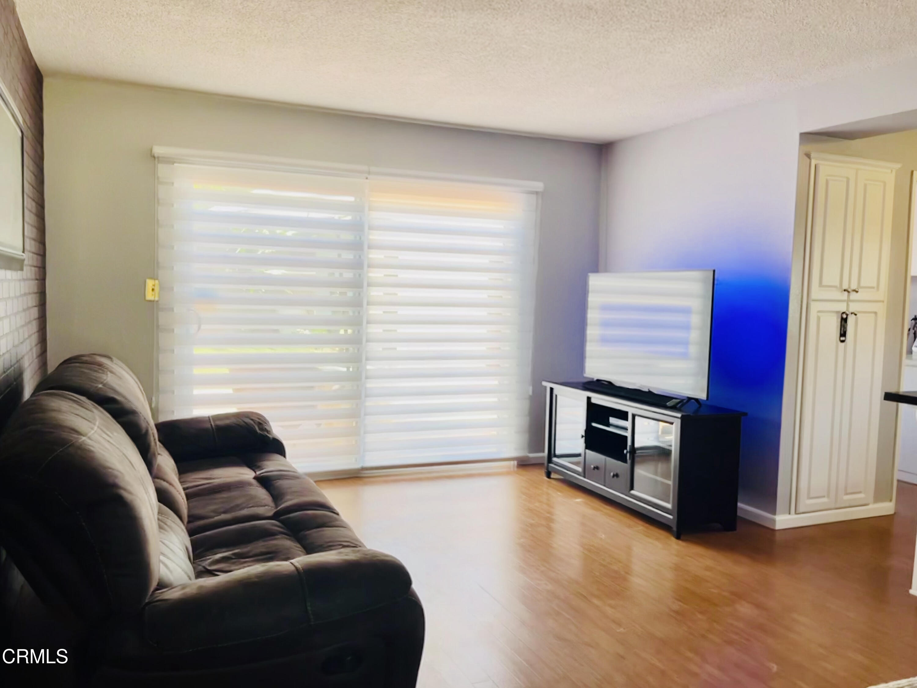 517 View Crest Drive Montebello, CA 90640 - Photo 5 of 21 a living room with furniture and a flat screen tv