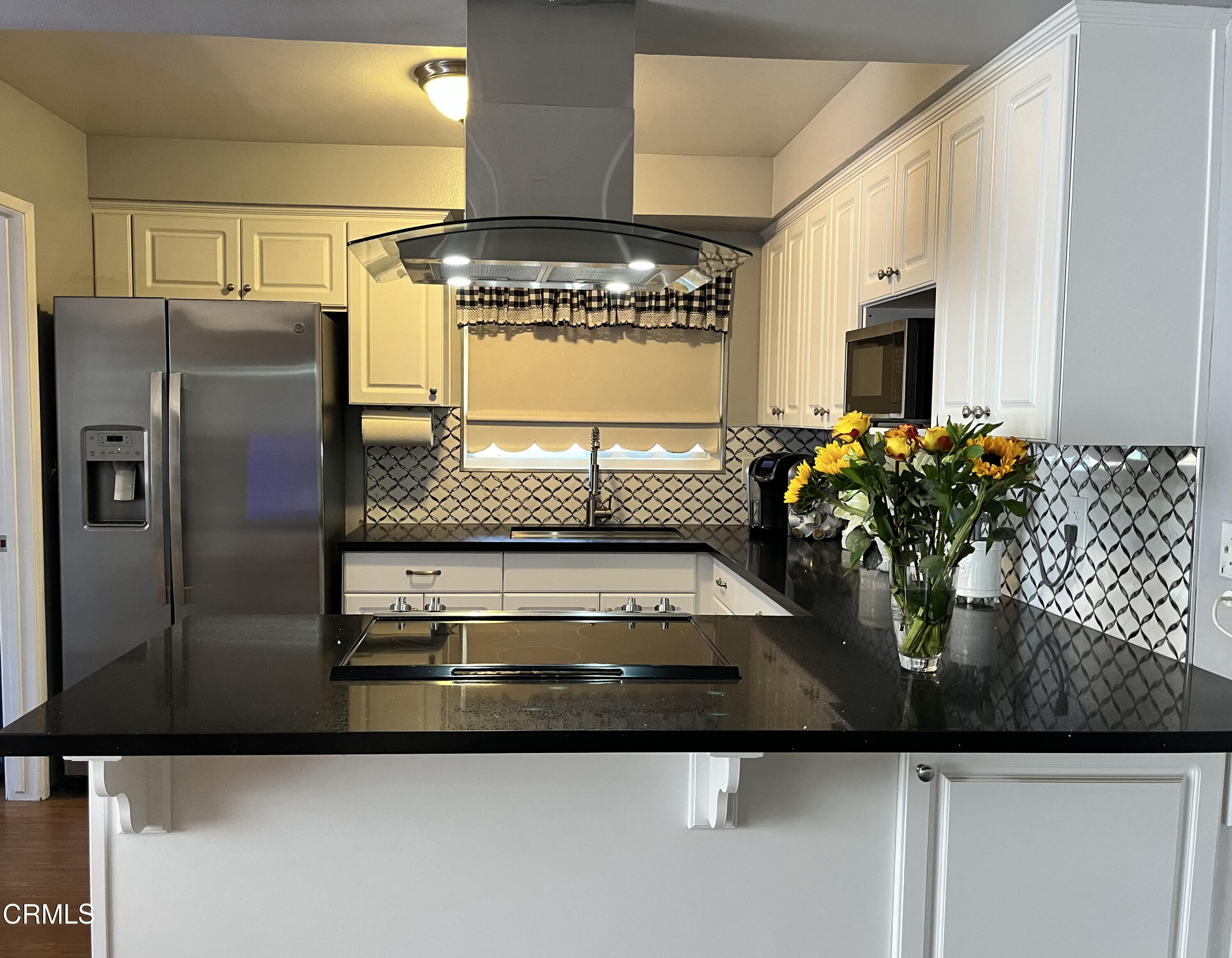 517 View Crest Drive Montebello, CA 90640 - Photo 6 of 21 a kitchen with stainless steel appliances granite countertop a sink and a refrigerator