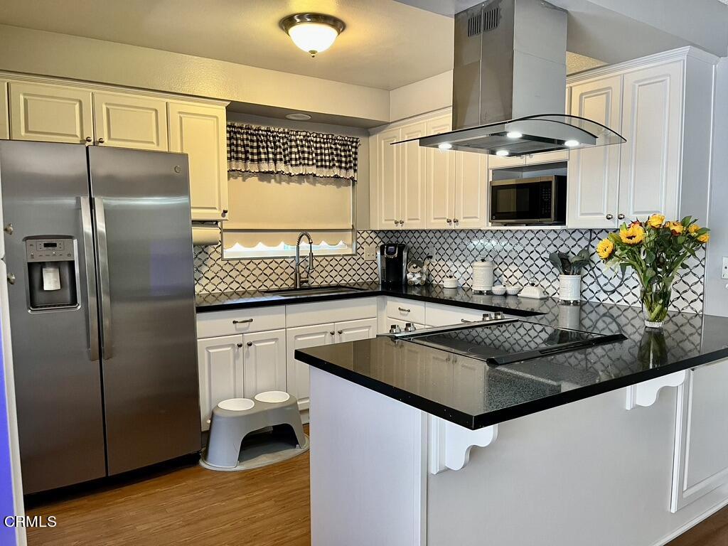 517 View Crest Drive Montebello, CA 90640 - Photo 7 of 21 a kitchen with stainless steel appliances granite countertop a sink stove and refrigerator