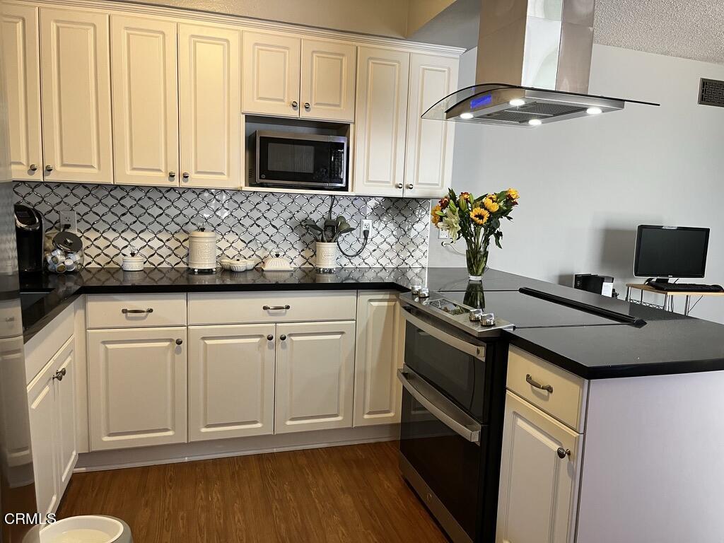 517 View Crest Drive Montebello, CA 90640 - Photo 8 of 21 a kitchen with granite countertop a sink stainless steel appliances and cabinets