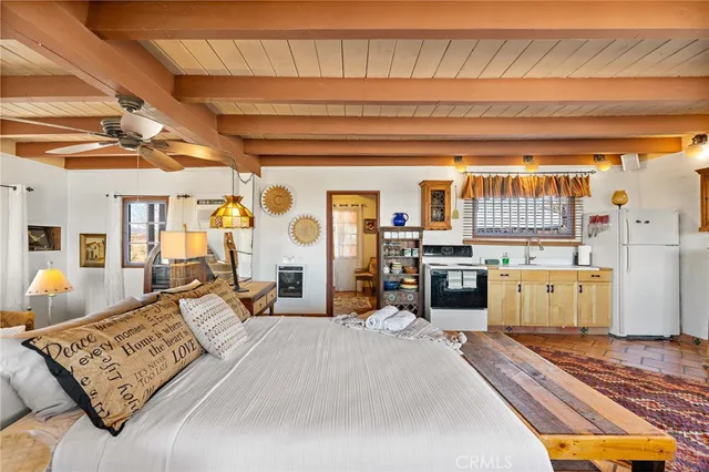 a bedroom with furniture and a window