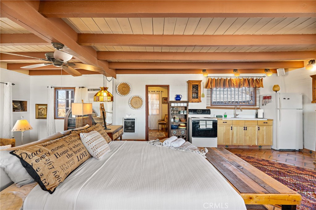 5148 Godwin Road Twentynine Palms, CA 92277 - Photo 13 of 39 a bedroom with furniture and a window