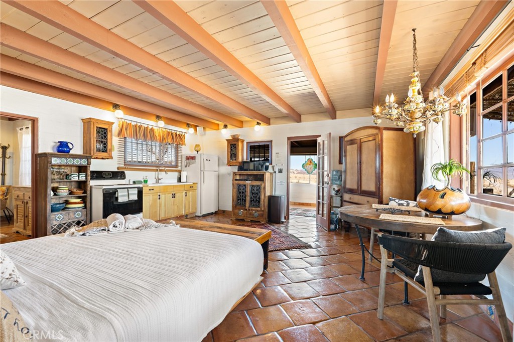 5148 Godwin Road Twentynine Palms, CA 92277 - Photo 17 of 39 a bed room with a bed and furniture