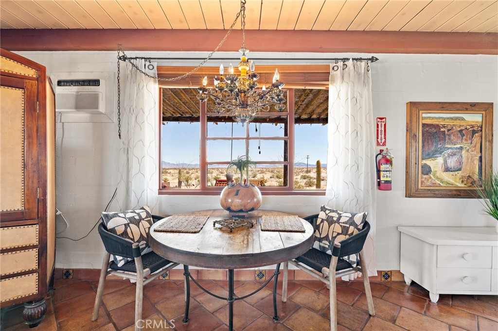 5148 Godwin Road Twentynine Palms, CA 92277 - Photo 19 of 39 a view of a dining room with furniture window and outside view