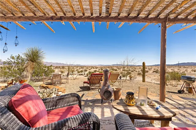 a view of a terrace with seating area