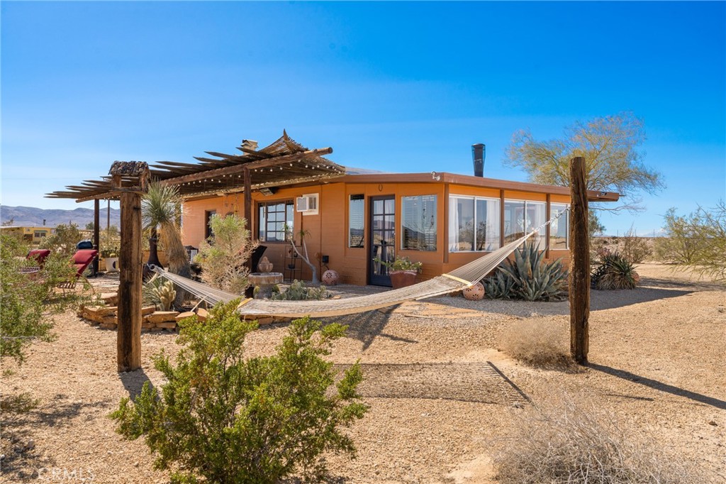 5148 Godwin Road Twentynine Palms, CA 92277 - Photo 3 of 39 a view of a house with snow on the wall