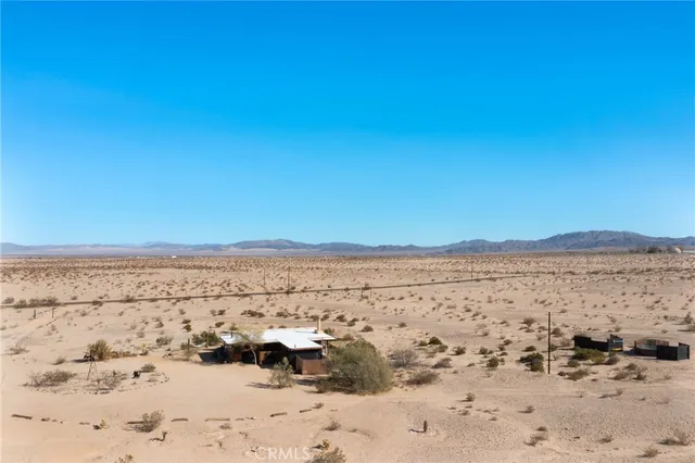 a view of beach and mountain