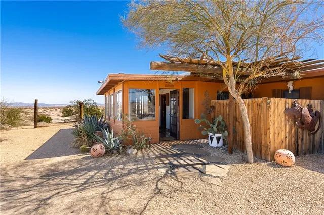 a view of a house with snow on the road