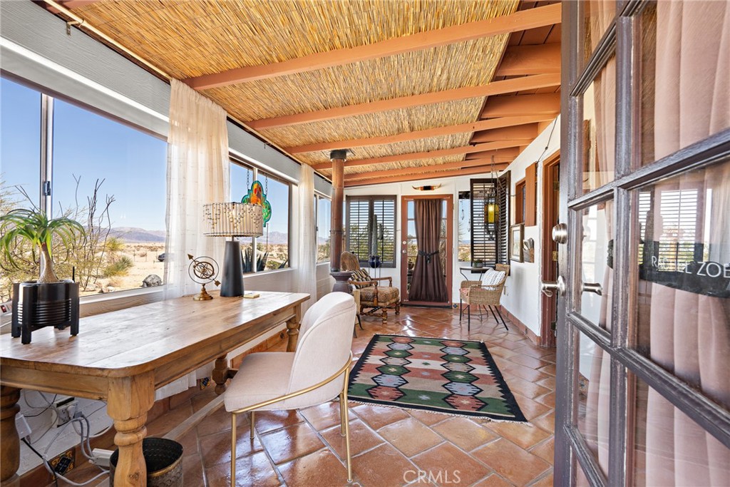 5148 Godwin Road Twentynine Palms, CA 92277 - Photo 9 of 39 a dining room with furniture and wooden floor
