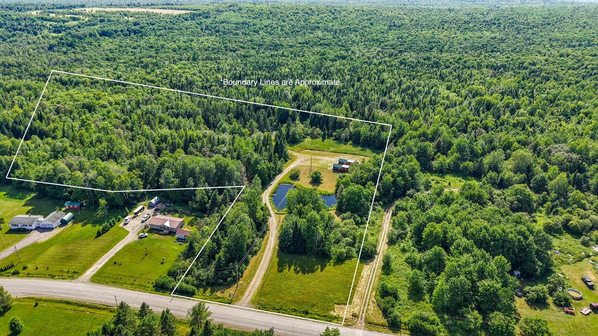 824 Shin Pond Road Patten, ME 04765 - Photo 11 of 49 dji_fly_20260712_155444_0848_17838862610